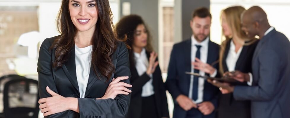 Businesswoman leader in modern office with businesspeople workin