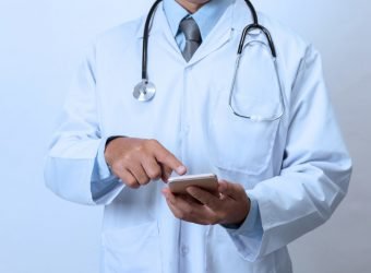 Doctor with smartphone