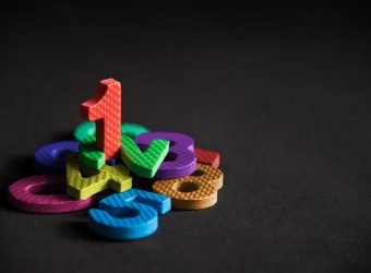 Business winner or leader, number one stand on the pile of numbe