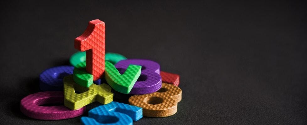 Business winner or leader, number one stand on the pile of numbe