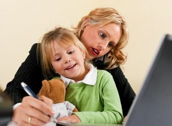 Businesswoman and mother is working at home