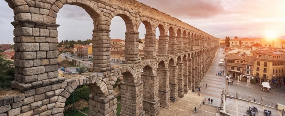 Dramatic sunset in famous Segovia aqueduct, Castilla y leon, Spain.