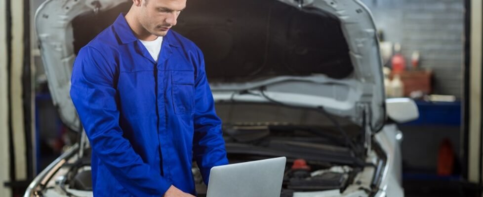 Mechanic using laptop