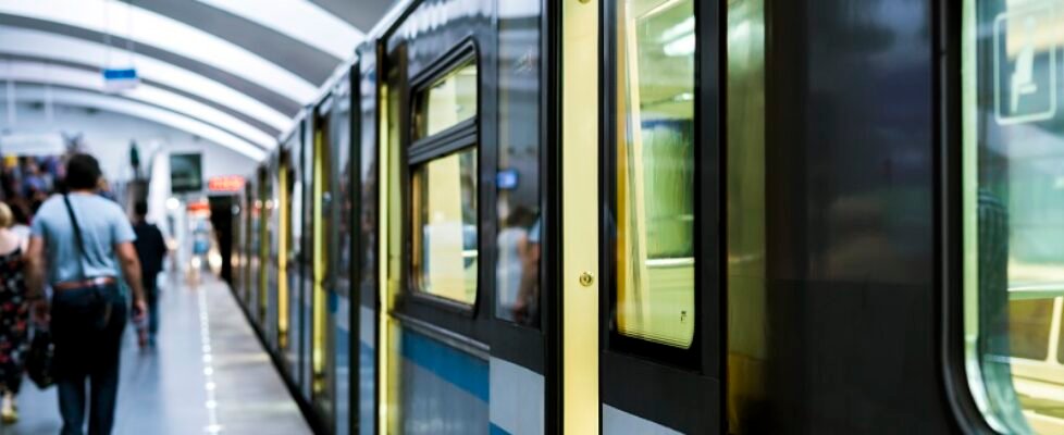 abstract modern subway station with crowd of people and closing doors
