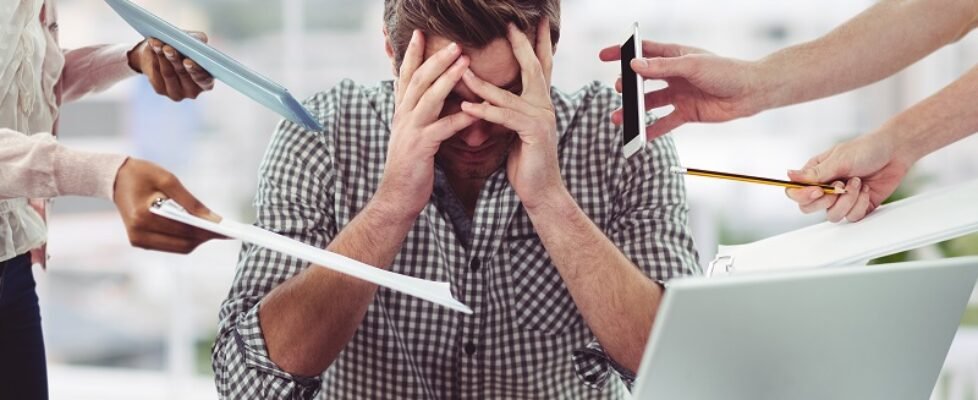 Stressed man frustrated with electronic devices