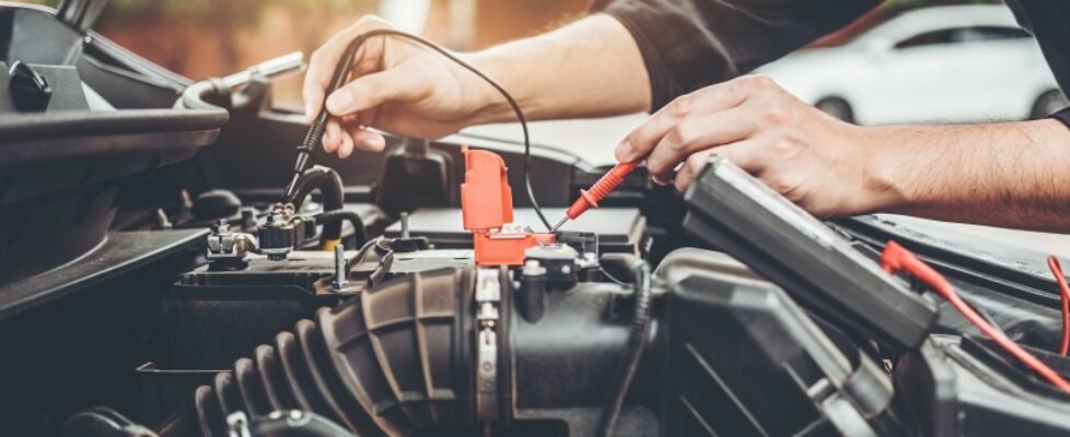 Auto mechanic working in garage Technician Hands of car mechanic