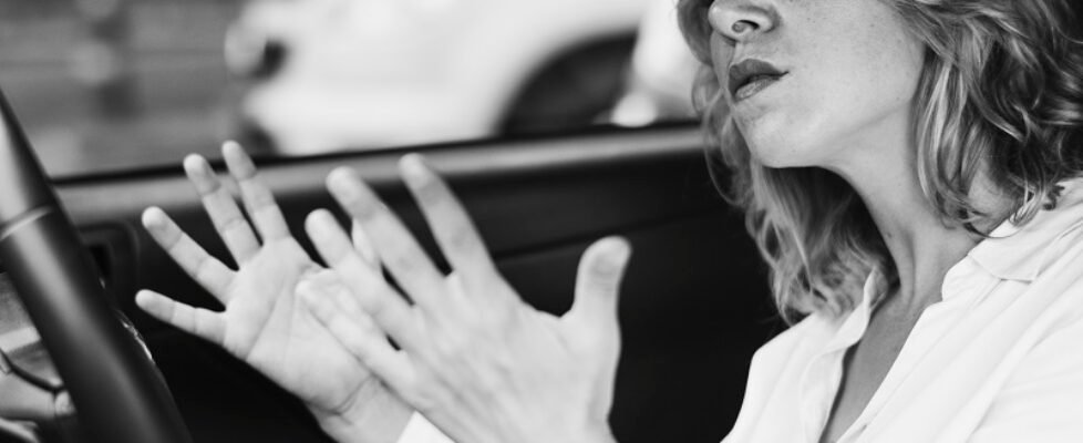 Frustrated woman stuck in a traffic