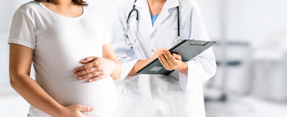 Pregnant Woman and Gynecologist Doctor at Hospital