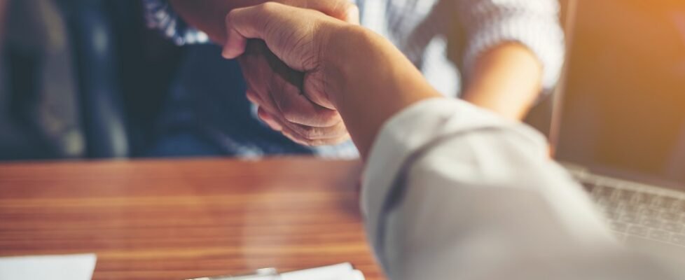 Business People Handshake Greeting Deal at work.