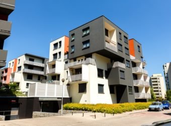 Exterior of a modern apartment buildings on a blue sky backgrou
