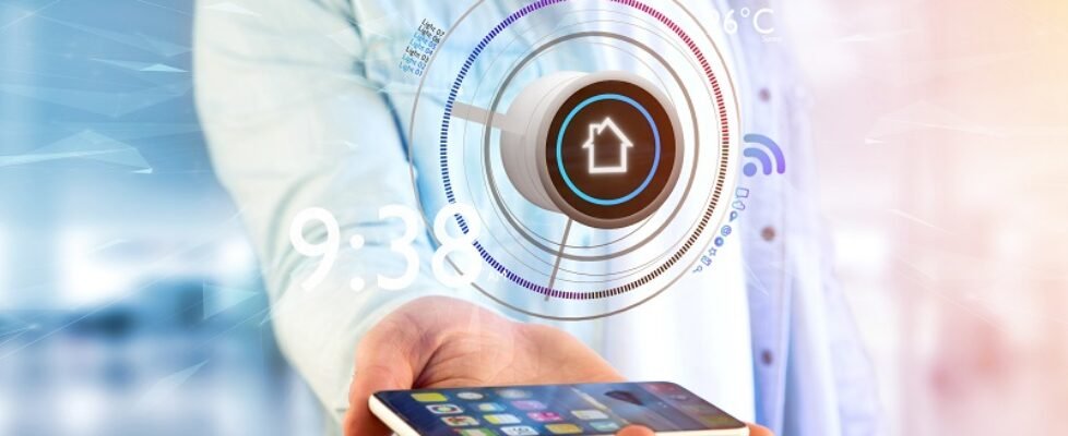 Businessman holding a Button of a smart home automation app over a smartphone- 3d rendering