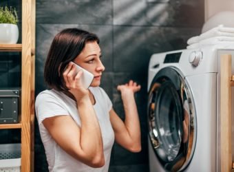 Woman calling for appliance repair service