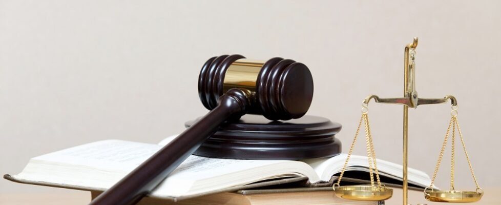 wooden gavel and books