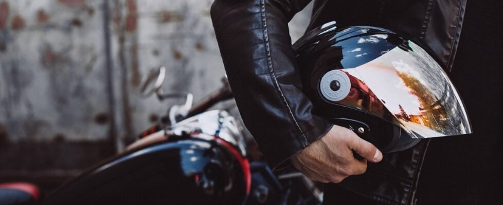 Handsome man biker travelling on mototrcycle