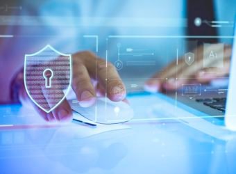 Business person logging in to his laptop