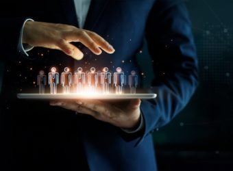 Businessman holding tablet and management group of people in hi