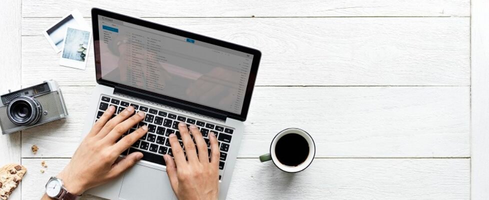 Aerial view of computer laptop on wooden table photography hobby concept