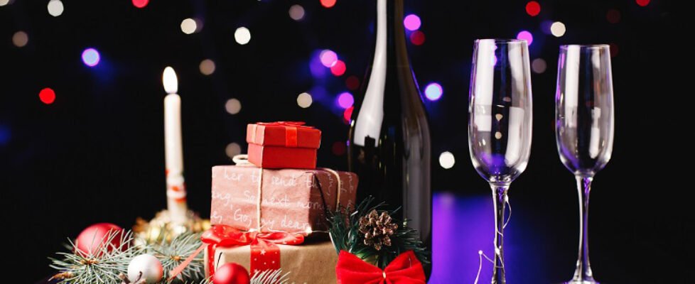 New Year and Christmas decor. Champagne flutes, little presents