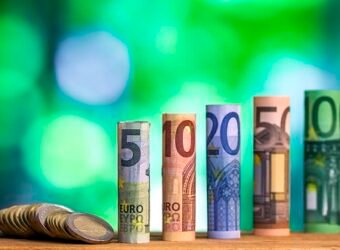 Five, ten, twenty, fifty and one hundred euro rolled bills bankn