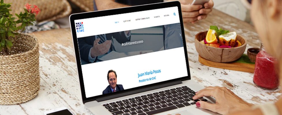 Back view of female freelancer keyboarding on laptop pc while working remotely. Stylish woman in shades using notebook computer with blank copy space screen for your text or advertising content