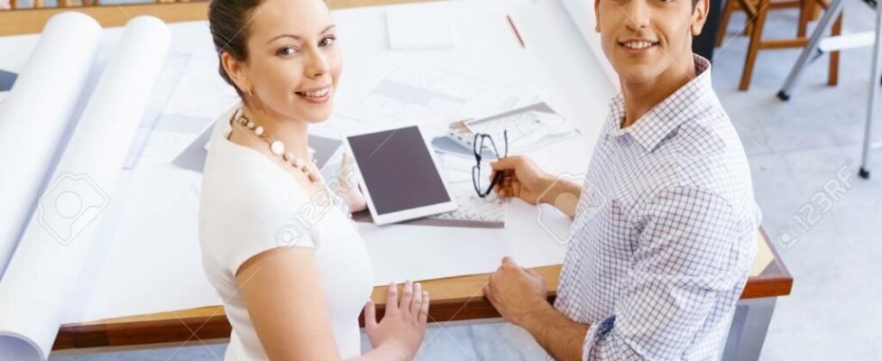 Two young architects in office