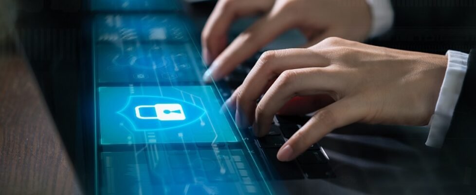 Technology concept with cyber security internet and networking, Businessman hand working on laptop, screen padlock icon on digital display.