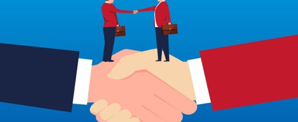 Two businessmen holding hands