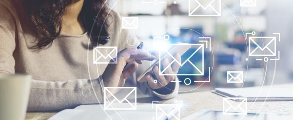 Unrecognizable Asian woman with phone, email