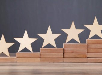 Wooden 5 stars on wooden block. Increase rating