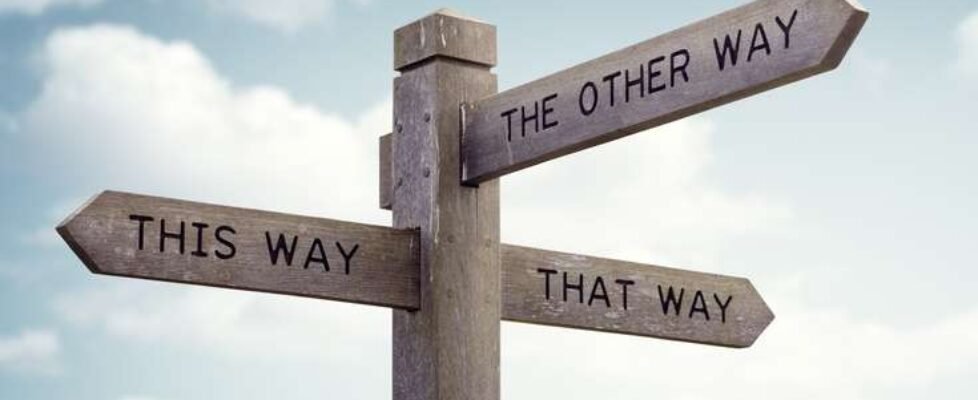 Crossroad,Signpost,Saying,This,Way,,That,Way,,The,Other,Way