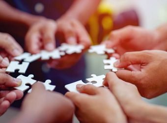 Team work, hands and jig Saw Unite with power Is a good team of