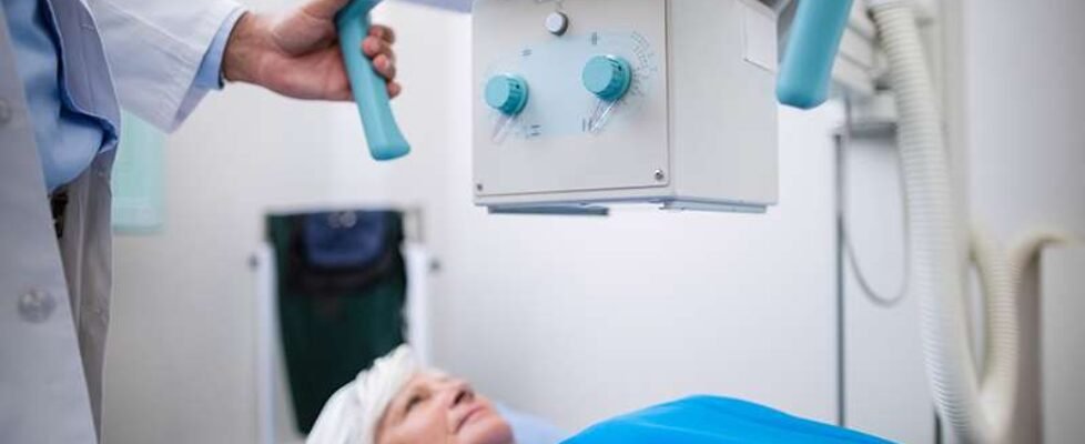 Senior woman undergoing an x-ray test in hospital