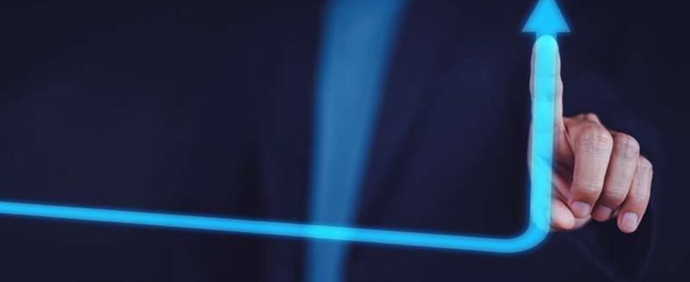 Business growth concept, Businessman pointing arrow graph and ch