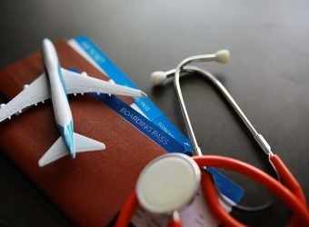 Passenger air insurance concept. Airplane, passport, boarding pa