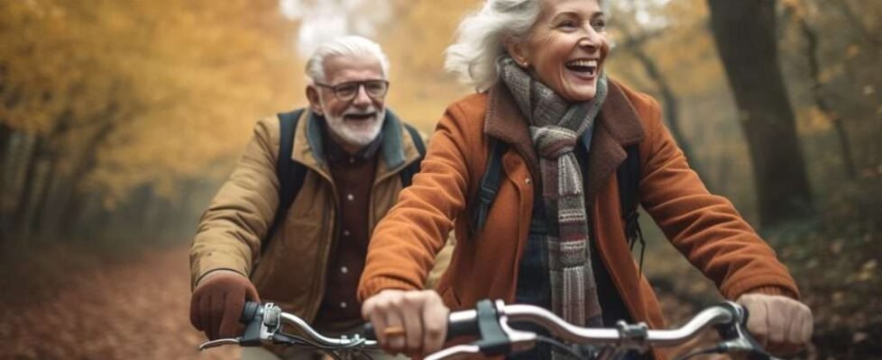 Senioren fahren Fahrrad im Herbst, generative AI