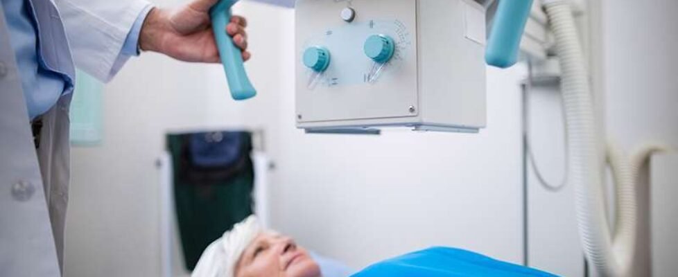 Senior woman undergoing an x-ray test in hospital