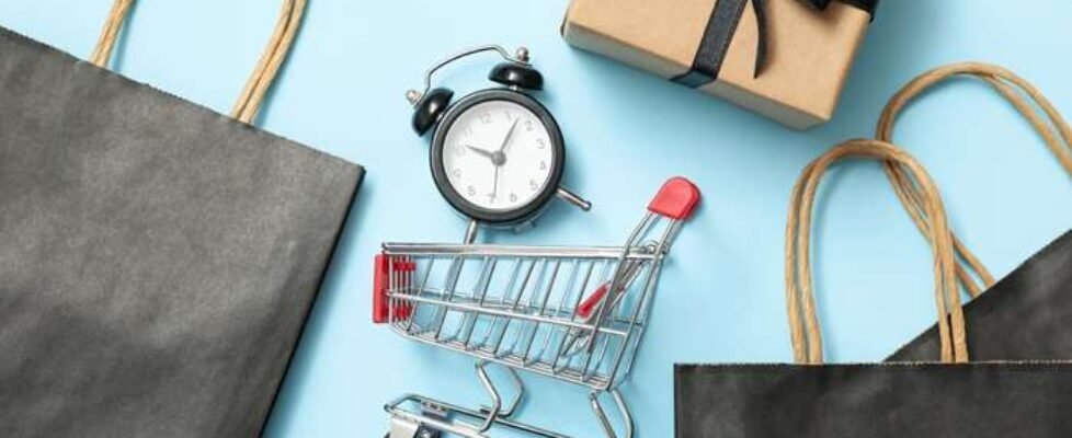 Sale concept with shop cart on blue background