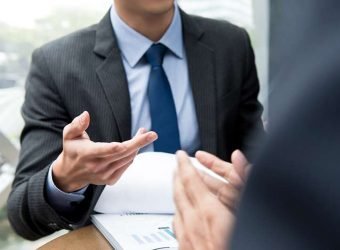 Business partners discussing document at the meeting