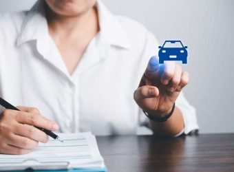 Business,Woman's,Hand,Protecting,Blue,Icon,Car,On,Desk.,Planning