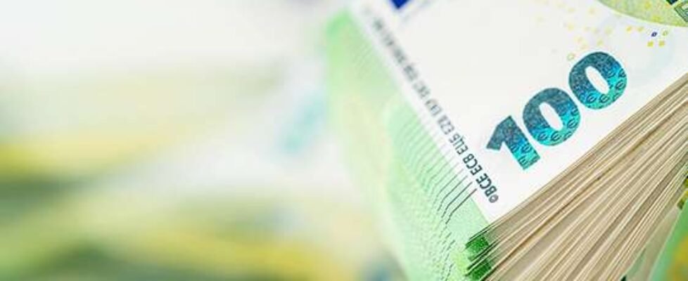 Stack of one hundred euro bill. Copy space