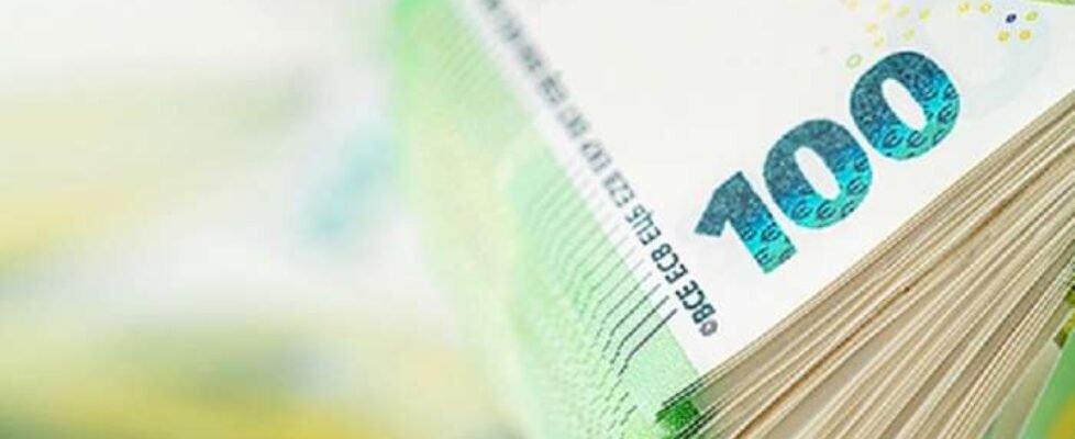 Stack of one hundred euro bill. Copy space