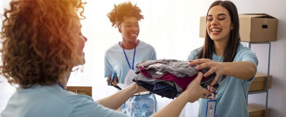 Volunteers Collecting Food Donations In Warehouse