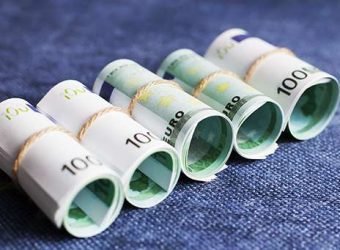 eurocurrency rolls on a blue background