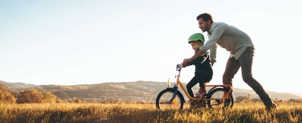 Father and son on a bicycle lane